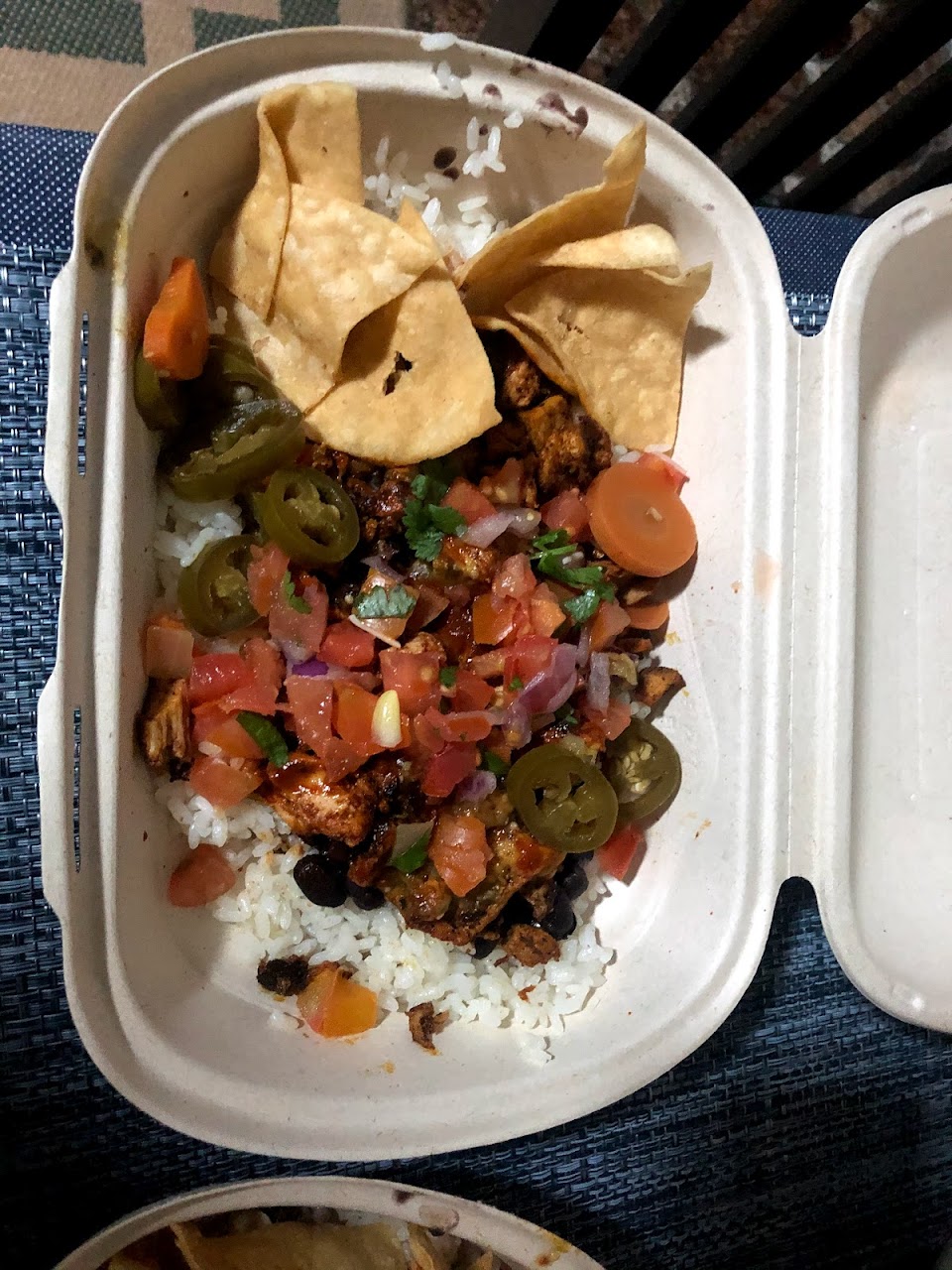 Takeaway bowl with corn chips, salsa, beans, and guacamole at Guzman y Gomez Toowong Village