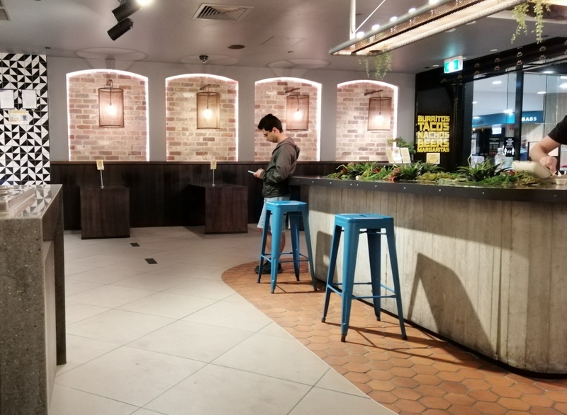Dining counter and seating inside Guzman y Gomez Toowong Village