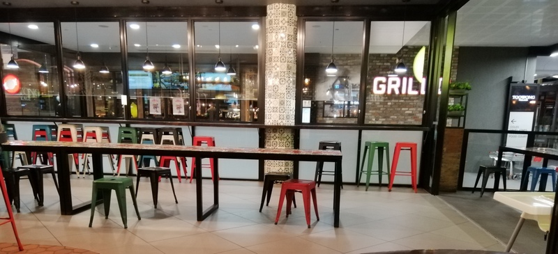 Dining area and counter at Guzman y Gomez Toowong Village