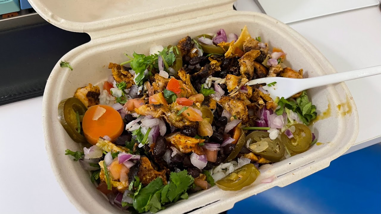Bowl with rice, beans, salsa, and vegetables at Guzman y Gomez Toowong Village